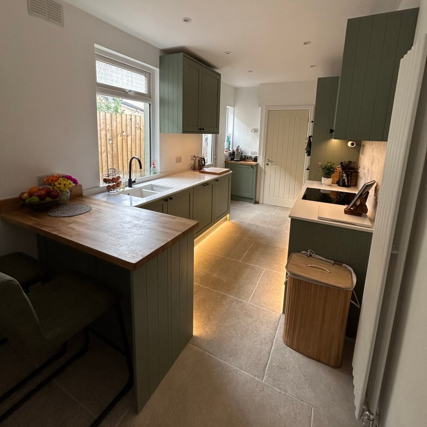 Completed Bedminster kitchen renovation with fitted cabinets, wood worktops and tiled flooring